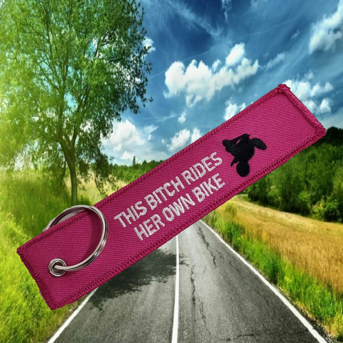 This Bitch Rides Her Own Bike (Pink) – Keyring,female riders, lady biker, biker chick, girl keyring, biker, motorbike, motorcycle keyring